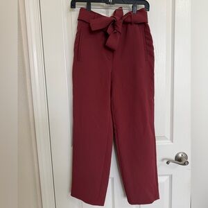 Aritzia’s Wilfred Deep Red Brick Tie-Waist Ankle Trousers